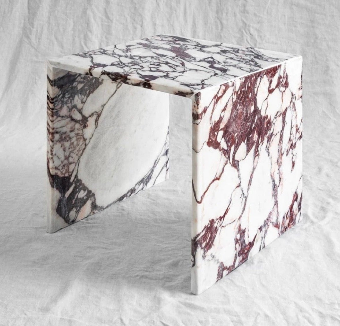Waterfall edge marble side table